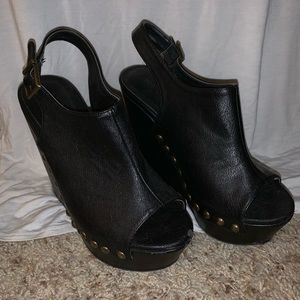 Black leather wedges with bronze studs